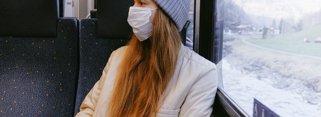 woman masked on a bus